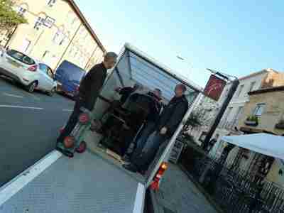 Grand piano being moved in a house
